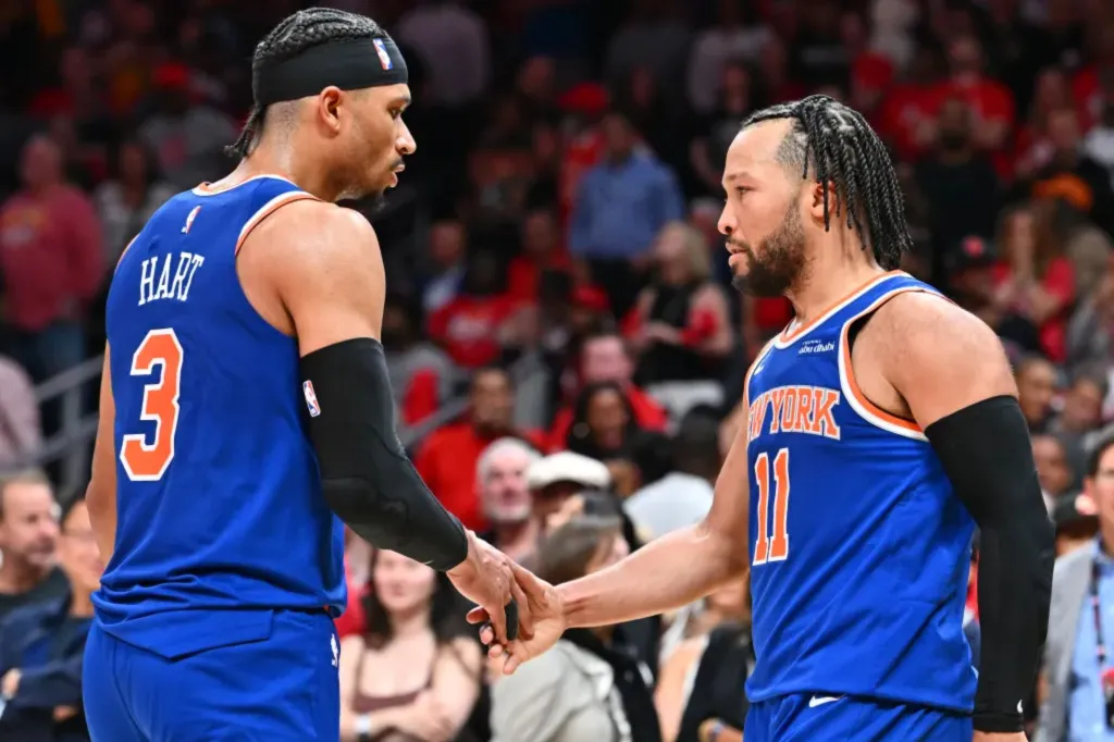 An image collage containing 1 images, Image 1 shows Josh Hart and Jalen Brunson high-fiving during an NBA game