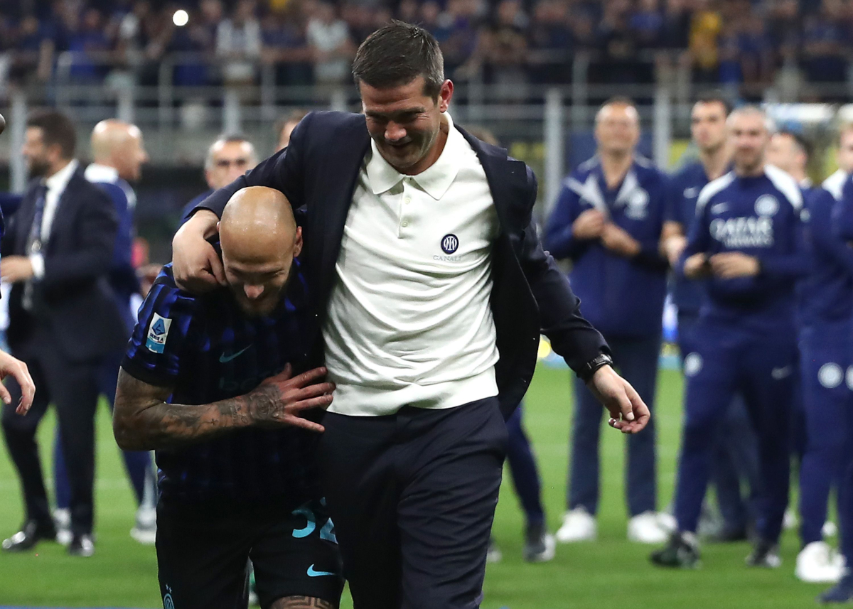 MILAN, ITALY - MAY 03: FC Internazionale coaches Cristian Chivu and Federico Dimarco celebrate after being confirmed as Serie A match between FC Internazionale and Parma Calcio 1913 at Giuseppe Meazza Stadium on May 03, 2026 in Milan, Italy. (Photo by Marco Luzzani/Getty Images)
