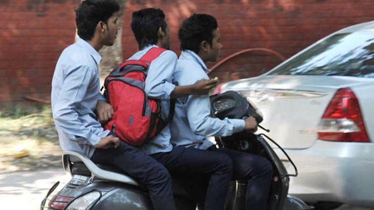 triple riding two wheeler illegal