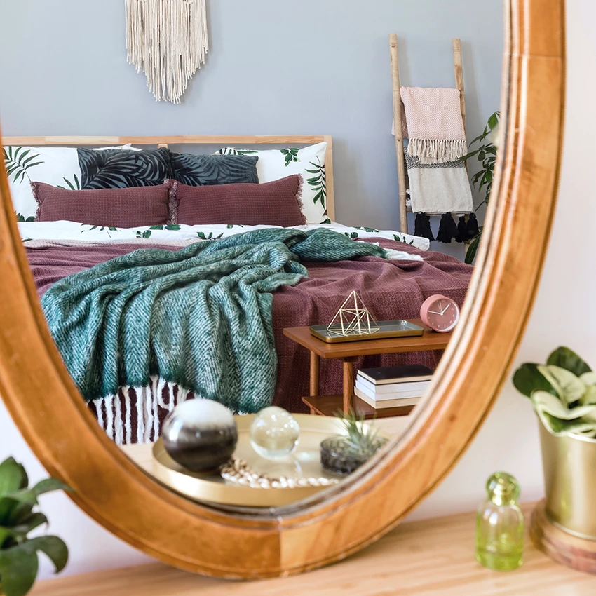 mirror across from bed 