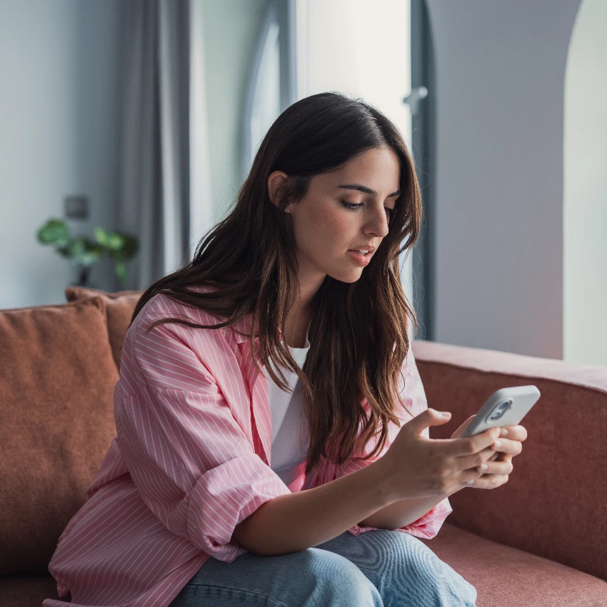 serious woman using phone