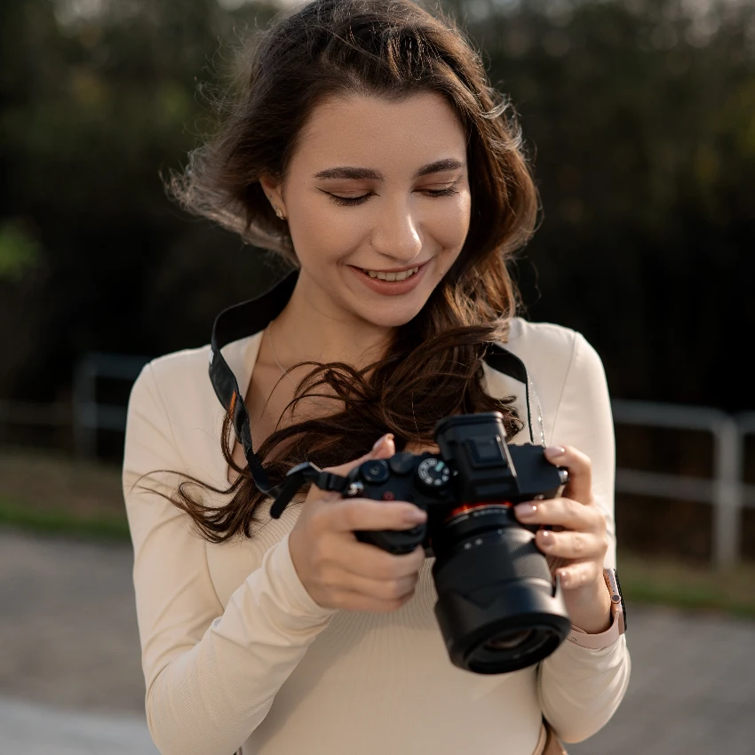 smiling woman holding camera outside understand the geometry of images
