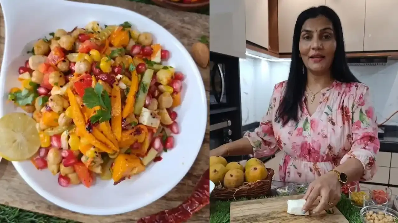 : A woman prepares a colorful protein salad featuring chickpeas, mango slices, pomegranate seeds, and fresh paneer in a kitchen.