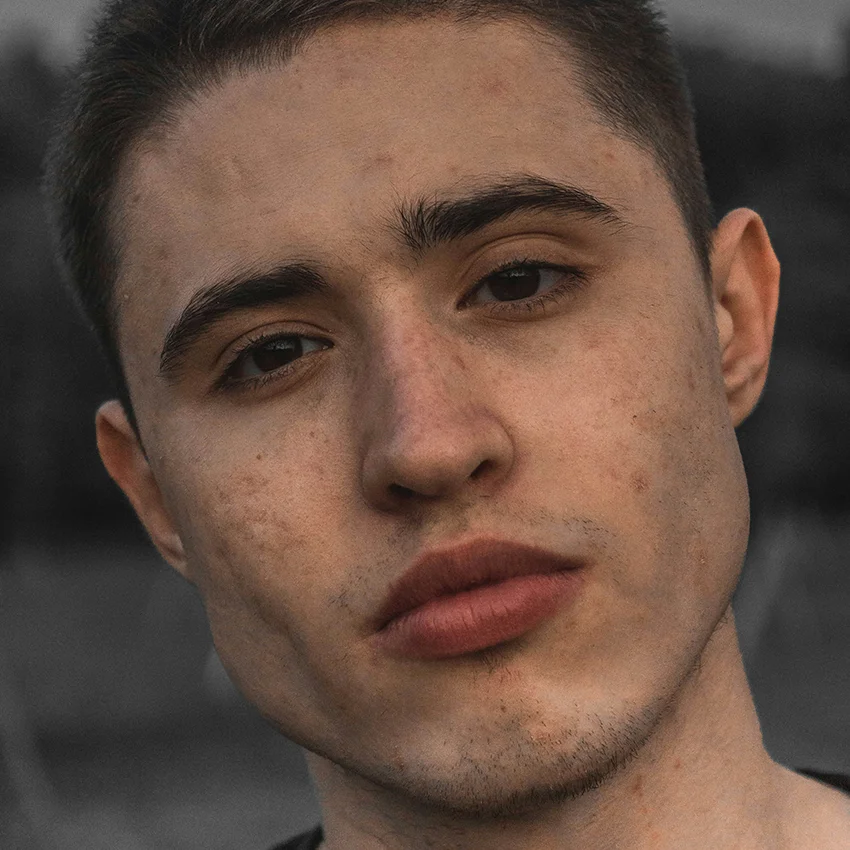 man with full lips making eye contact