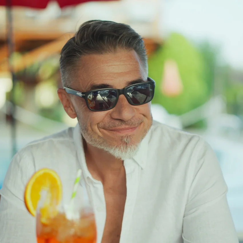 older man wearing sunglasses on vacation