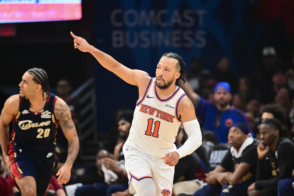 New York Knicks guard Jalen Brunson points during a game against the Cleveland Cavaliers.