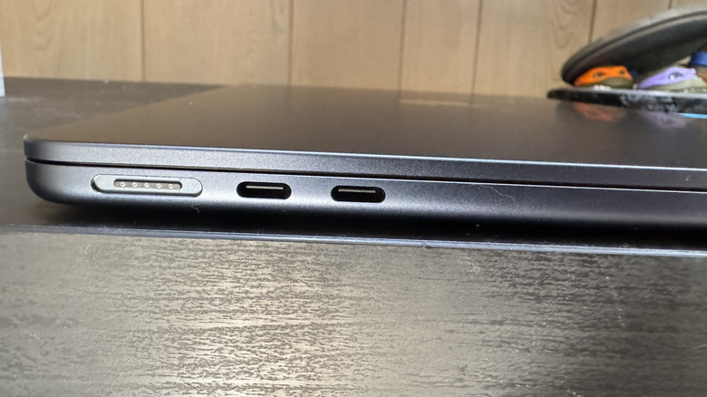 A close up shot of an Apple MacBook Air M4, showing two USB-C ports next to a MagSafe charging port