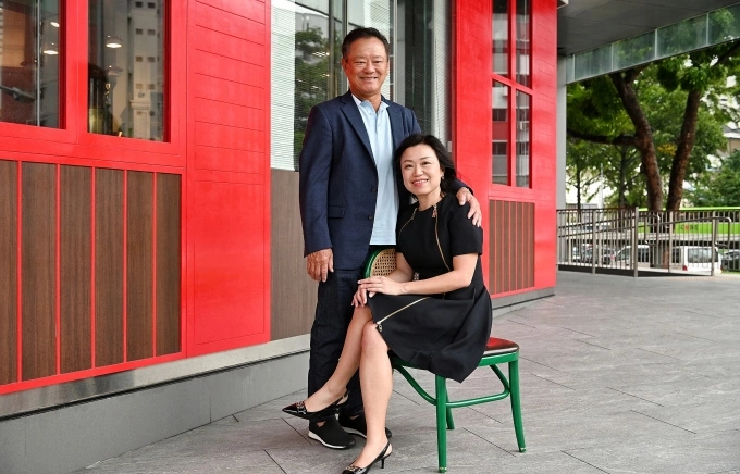 Choo Chong Ngen (L), founder and chairman of Worldwide Hotels and his daughter and CEO, Carolyn Choo. Photo by AFP