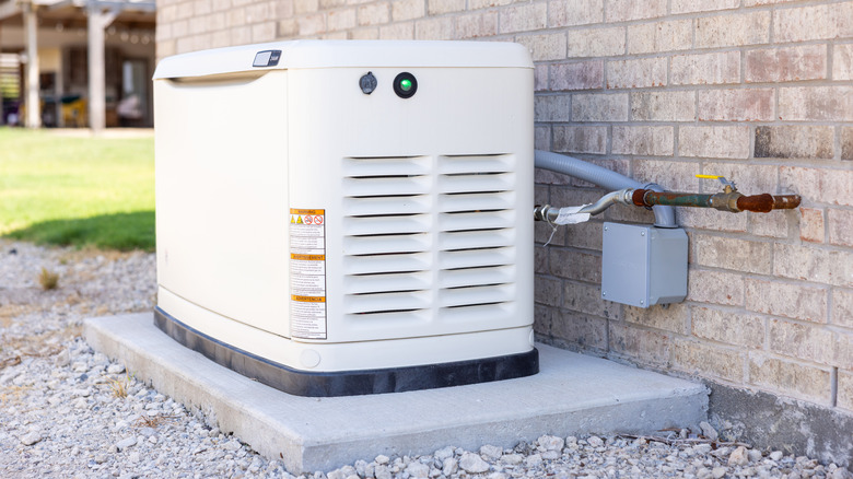 A Generac standby generator sitting on a concrete pad