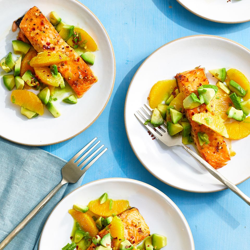 a recipe photo of the Air-Fryer Orange Salmon with Avocado Salsa served on plates Credit: Photographer: Brie Passano, Food Stylist: Greg Luna
