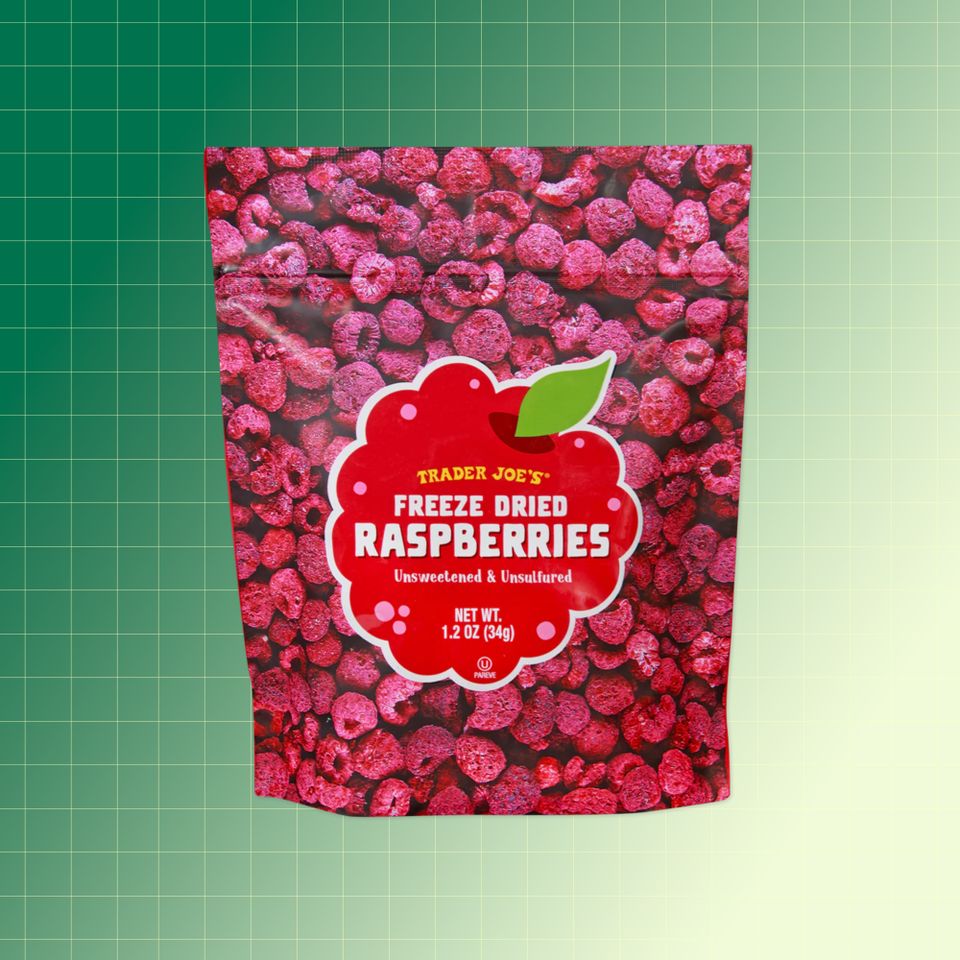 Trader Joes bag of freezedried raspberries against a gradient background Credit: Trader Joe's. EatingWell design.