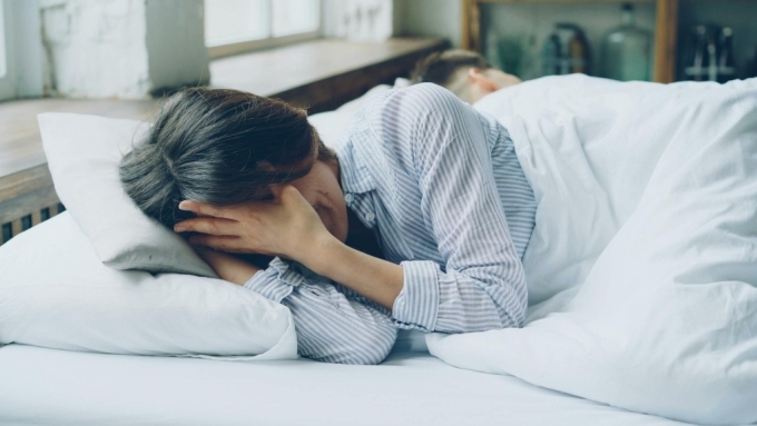A person struggling to sleep. Photo by Pexels