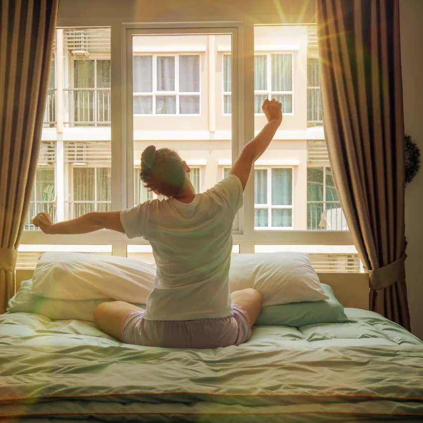 woman with vivid images in her dreams waking up in the morning