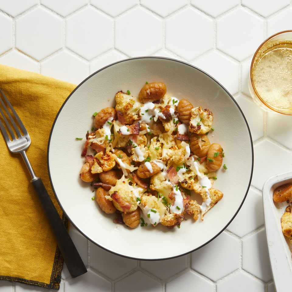 a recipe photo of the Sheet-Pan Loaded Cauliflower Gnocchi served on a plate Credit: Photographer: Stacy K. Allen. Food Stylist: Ana Kelly, Prop Stylist: Christina Brockman