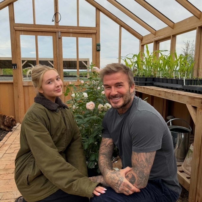 David Beckham and his daughter Harper sit by a pot of The Sir David Beckham Rose in the garden in Cotswold estate. Photo by Instagram/David Beckham