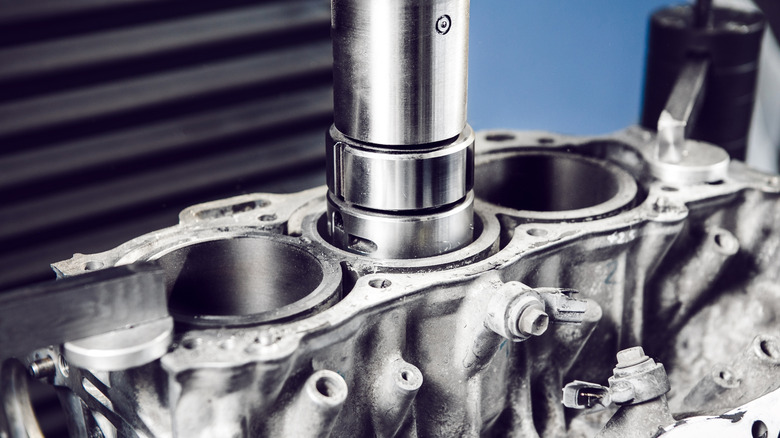 Dry cylinder sleeve being press-fit into three-cylinder engine