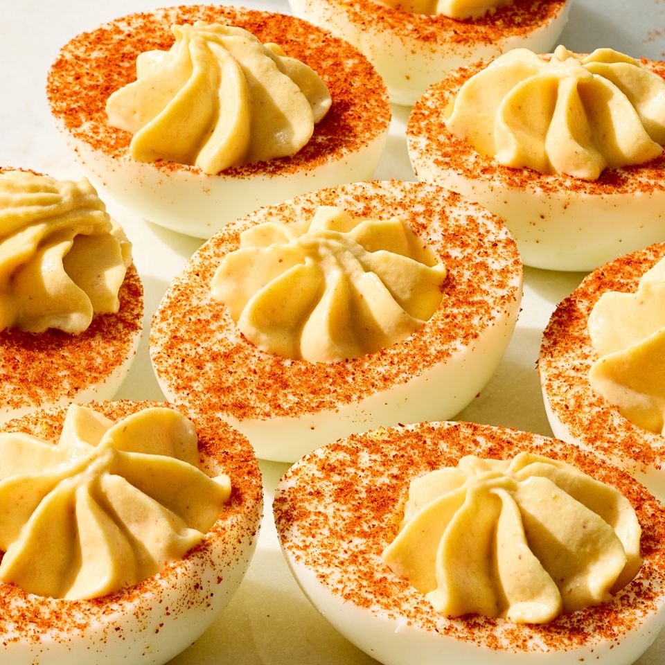 A closeup of deviled eggs topped with paprika Credit: Photographer: Grant Webster, Food stylist: Annie Probst, Prop stylist: Kristen Schooley