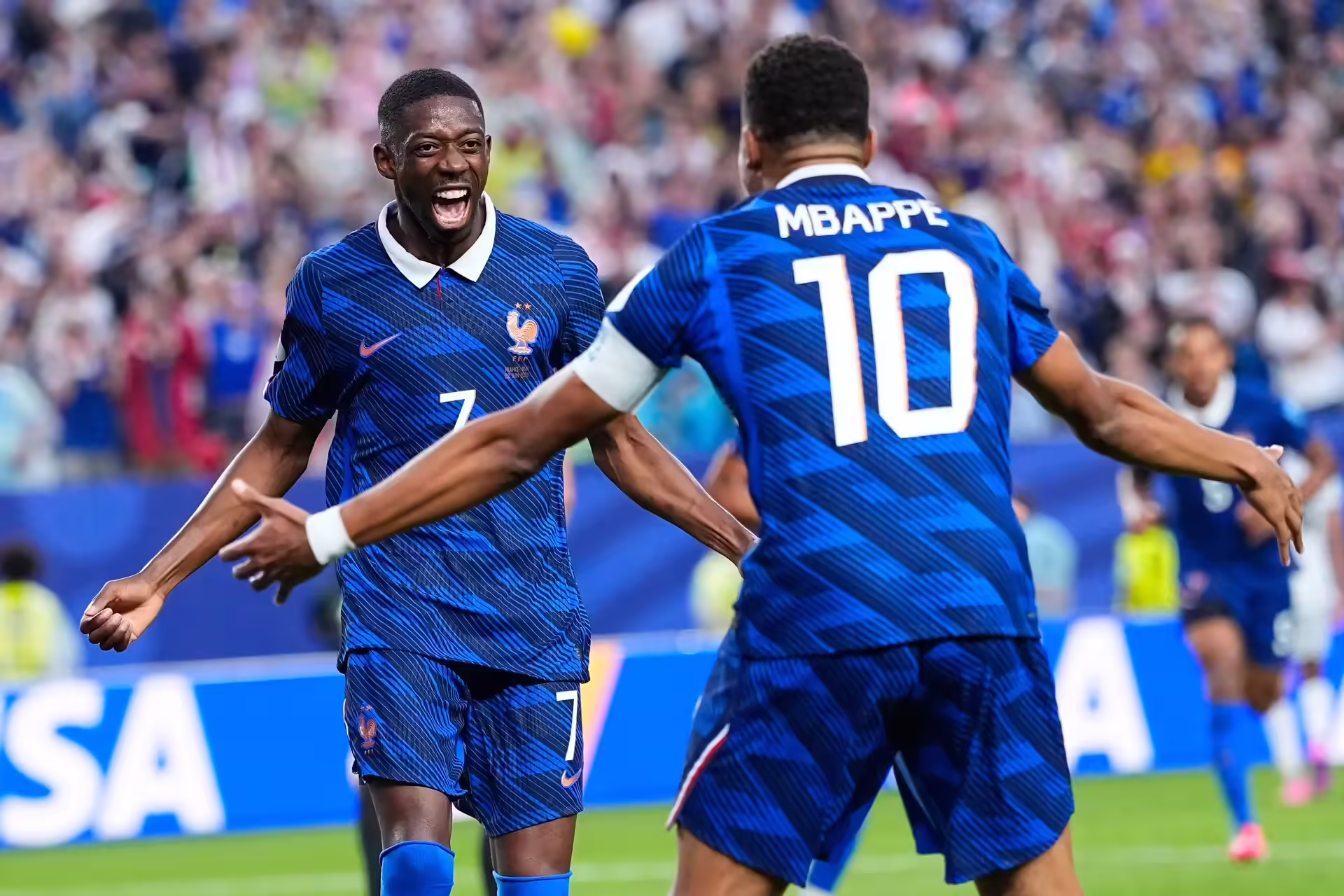 France's Ousmane Dembele (7) congratulates teammate Kylian Mbappe (10) after he scored their second goal during the World Cup Group I soccer match between France and Iraq in Philadelphia, Monday, June 22, 2026. (AP Photo/Petr David Josek) Iraq France WCup Soccer