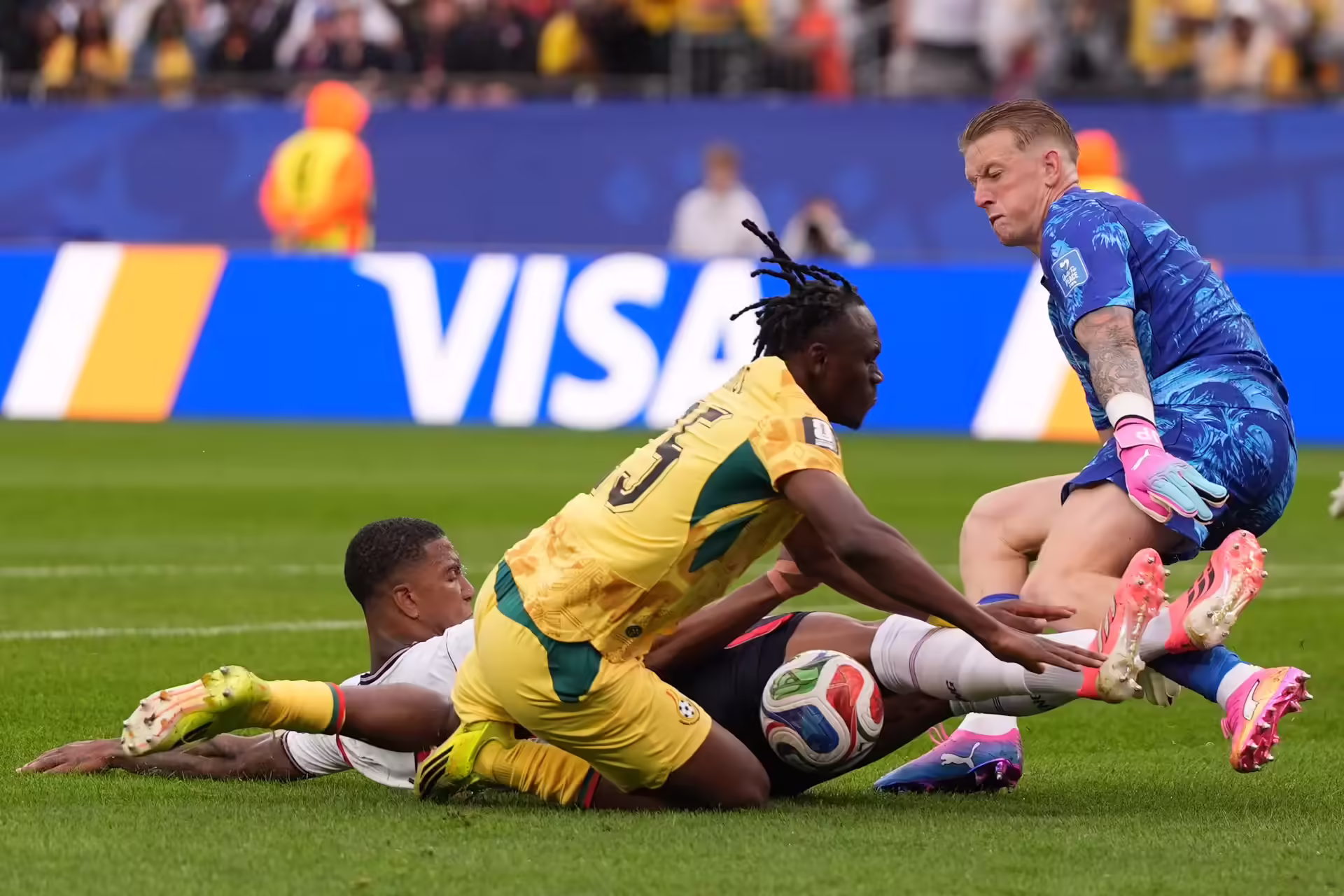England's Ezri Konsa (2) clears the ball in front pf Ghana's Prince Adu (25) during the World Cup Group L soccer match between England and Ghana in Foxborough, Mass., near Boston, Tuesday, June 23, 2026. (AP Photo/Charlie Krupa) APTOPIX Ghana England WCup Soccer
