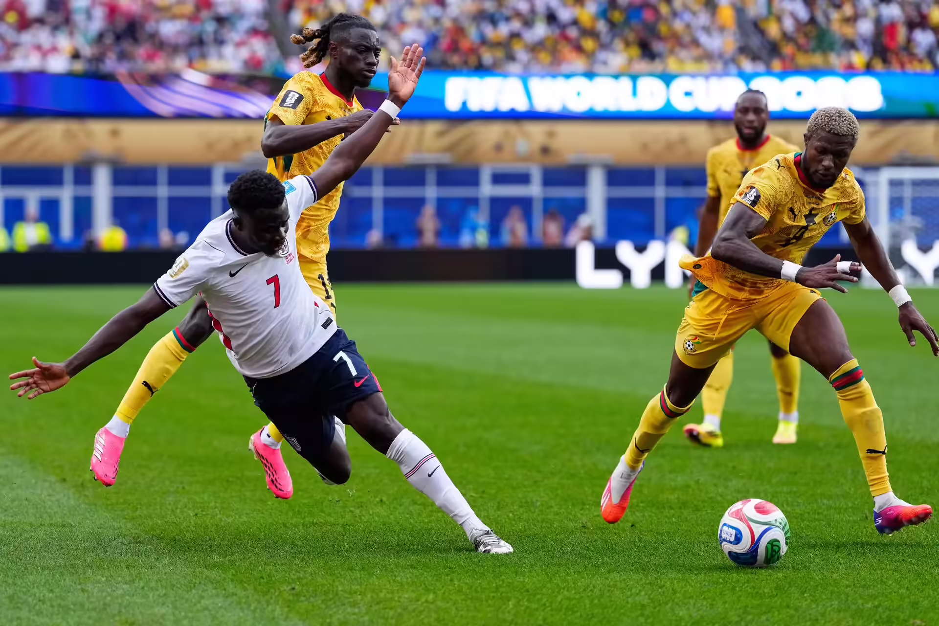 England's Bukayo Saka (7) and Ghana's Kwasi Sibo (8) go for the ball during the World Cup Group L soccer match between England and Ghana in Foxborough, Mass., near Boston, Tuesday, June 23, 2026. (AP Photo/Petr David Josek) Ghana England WCup Soccer