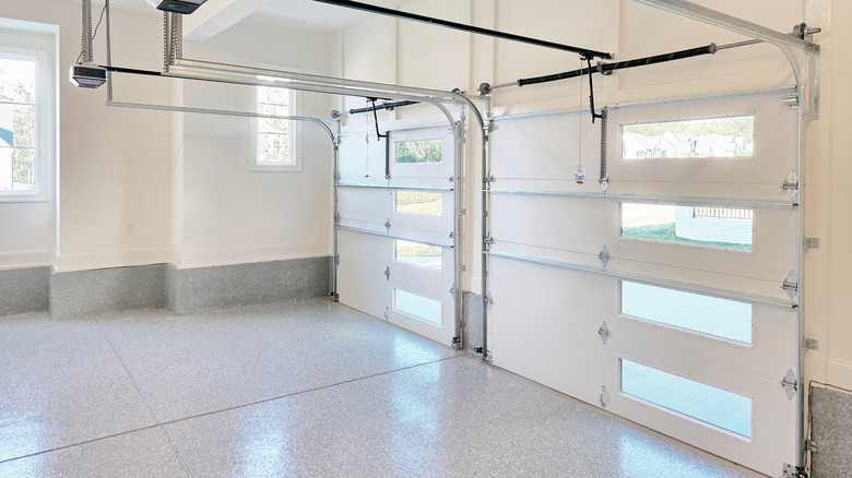 Upgraded flooring with reflective qualities in a two car garage