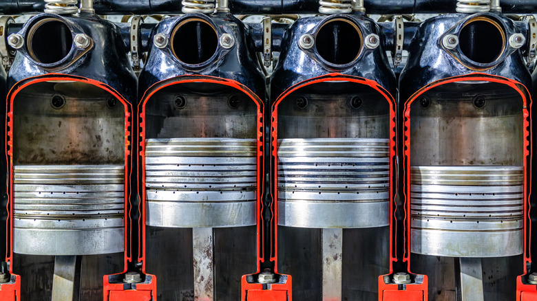 A cross section of cylinders showcasing their pistons in an engine