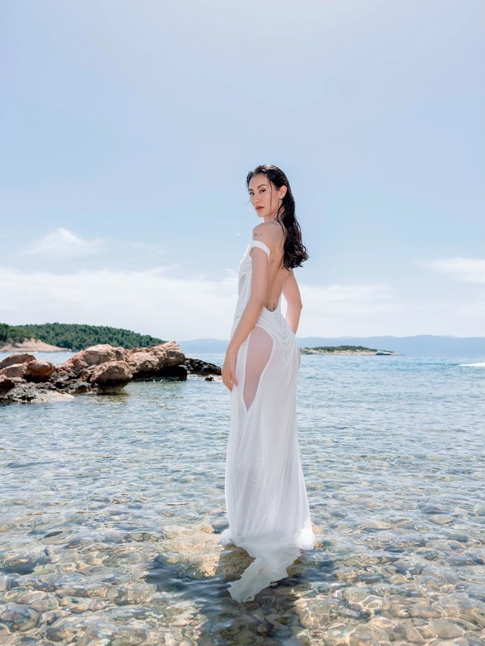 At the intimate rehearsal dinner at Amanzoe, Liu wore a custom ivory gown by Valentino, the Rome, Italy-based house known for dramatic, sculptural eveningwear, which was designed to evoke a Greek goddess with a fitted silhouette and two long flowing panels.