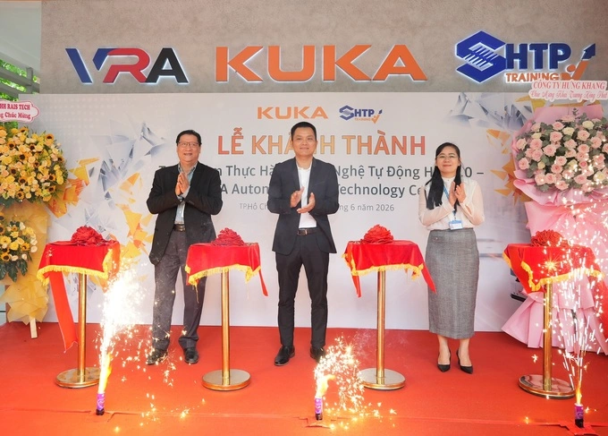 Representatives from the parties cutting the ribbon at the inauguration of the center. Photo courtesy of Kuka Vietnam