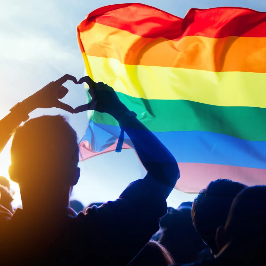 6 events that generation jones experienced that make them completely different from boomers and gen x generation jones man hearts a pride flag at hiv/aids march
