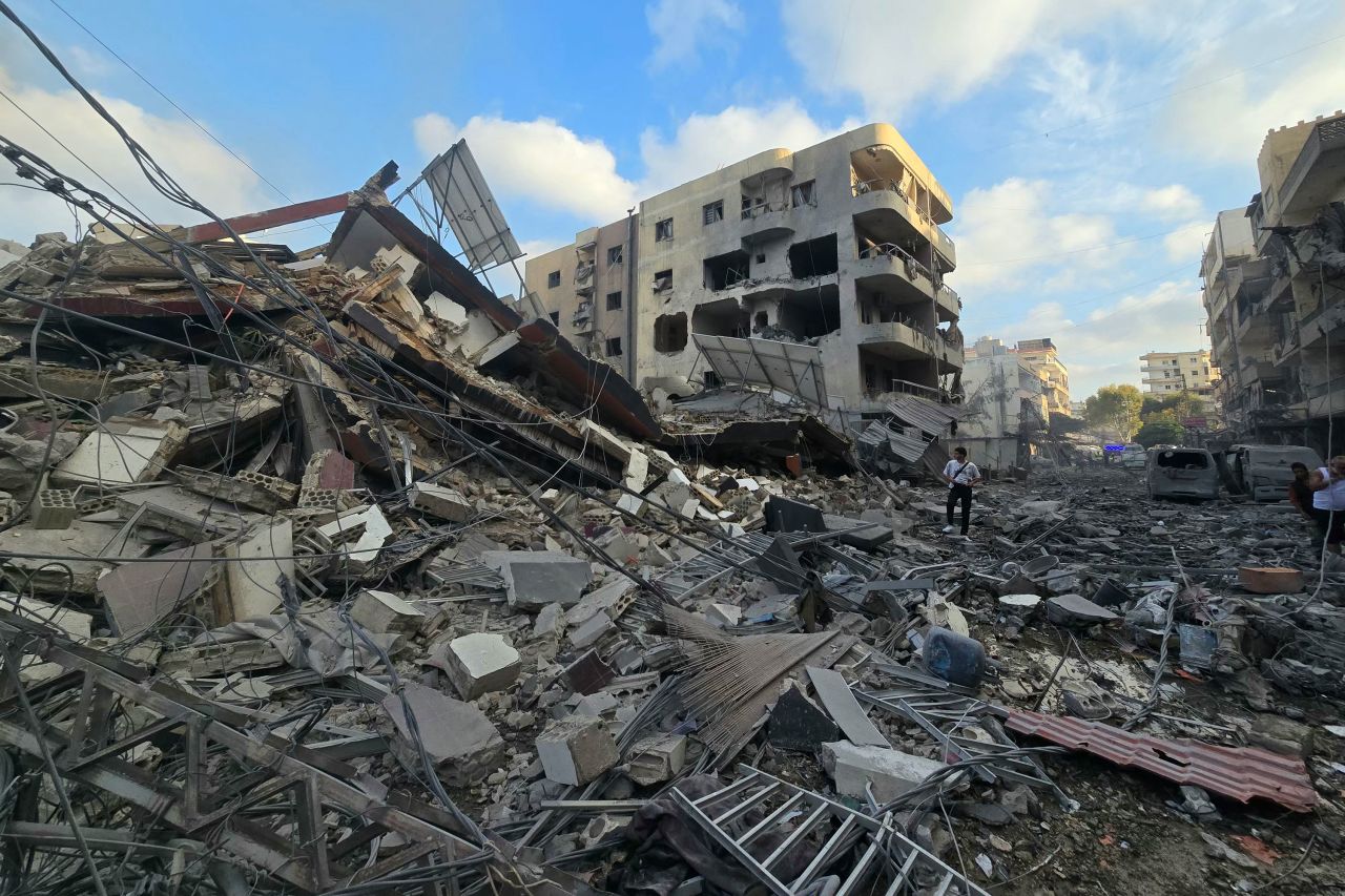 People gather at the site of an Israeli strike that hit near a hospital in Tyre, Lebanon, on June 1.