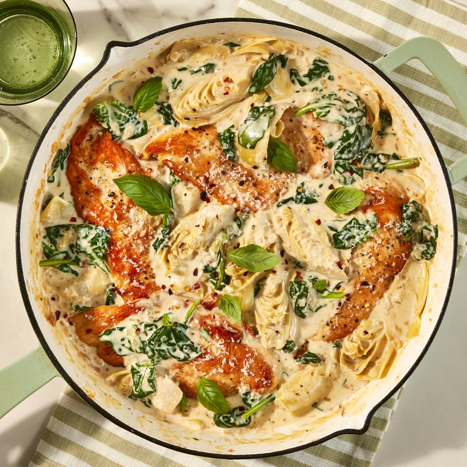 an overhead image of the Creamy Spinach and Artichoke Chicken Skillet Credit: Photographer: Jen Causey, Food Stylist: Emily Nabors Hall, Prop Stylist: Julia Bayless