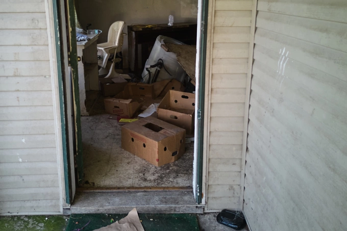 Old furniture is scattered inside the house. Photo: AP