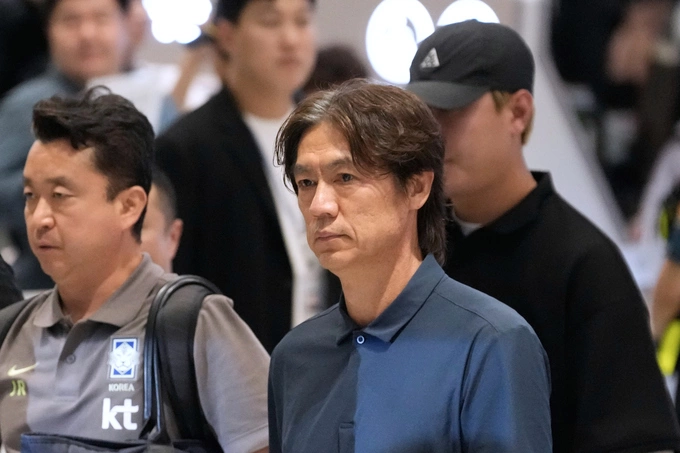 South Korea national team coach Hong Myung-bo (C) returns to Incheon International Airport, South Korea on June 30, 2026, after resigning following the national teams early elimination from the World Cup. Photo by AP