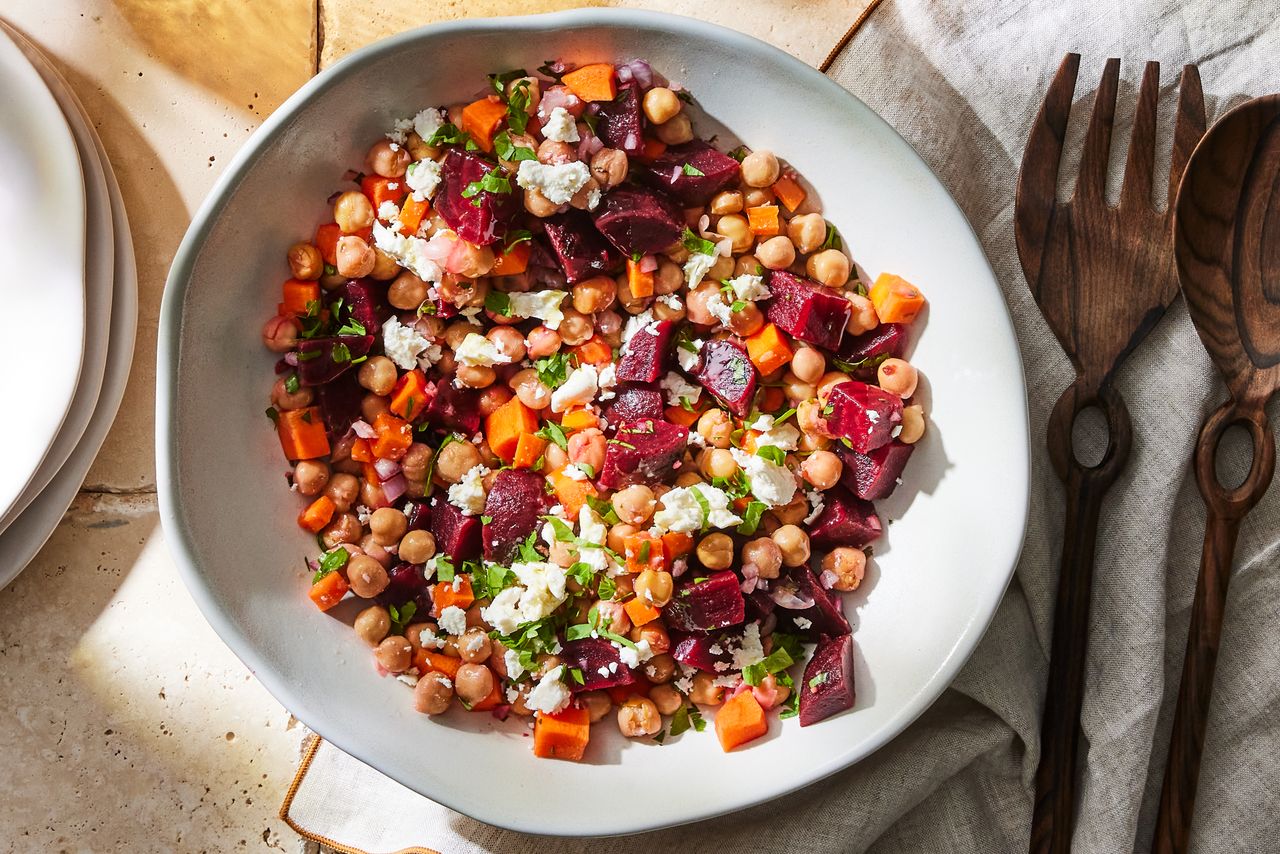 a recipe photo of the Chickpea, Beet & Feta Salad with Lemon-Garlic Vinaigrette Credit: Photographer: Rachel Marek, Food stylist: Holly Dreesman, Prop stylist: Addelyn Evans