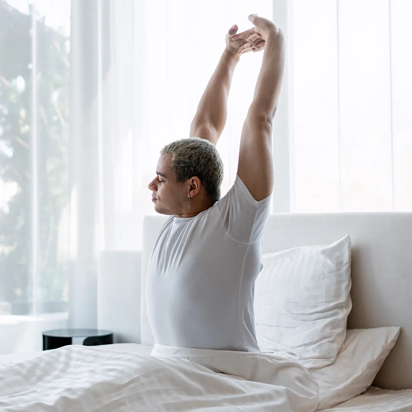 man waking up well rested