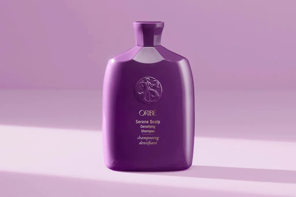 Oribe Serene Scalp Densifying Shampoo in a purple bottle.