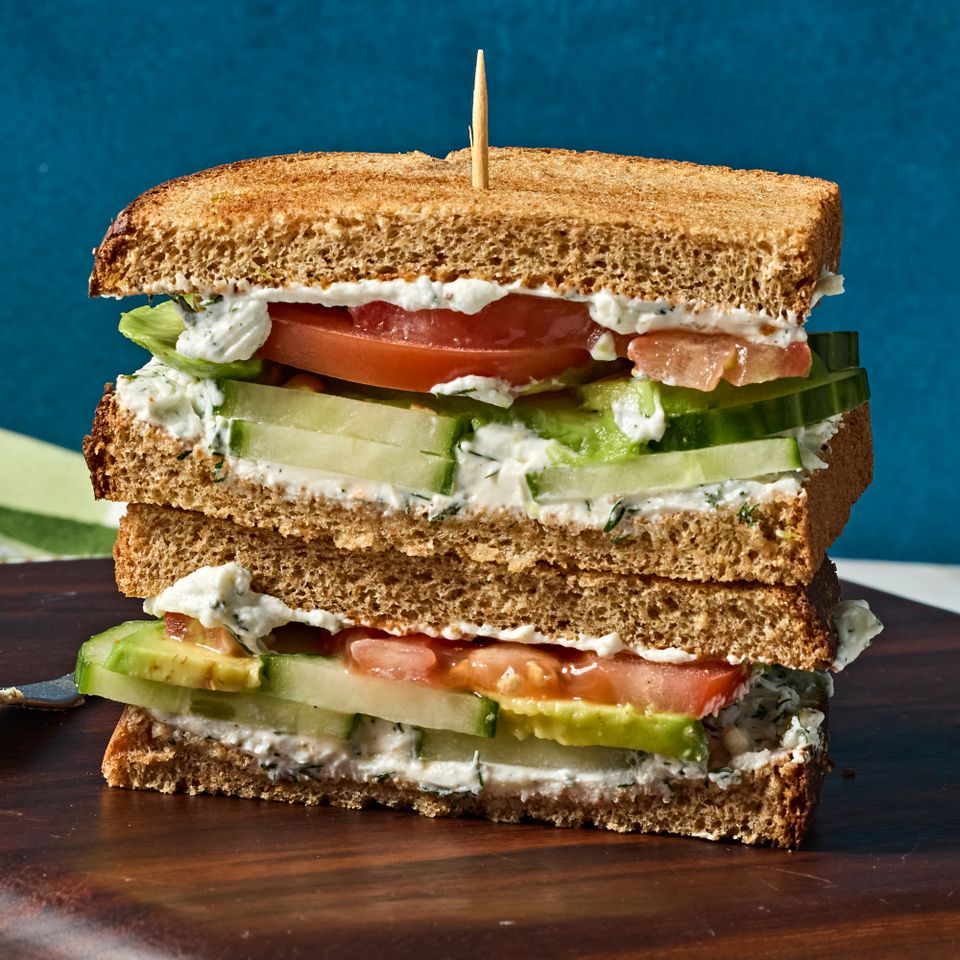 A recipe image of Cucumber, Avocado, Tomato & Goat Cheese Sandwich. Credit: Photographer: Jen Causey, Food Stylist: Margaret Monroe Dickey, Prop Stylist: Christina Daley.