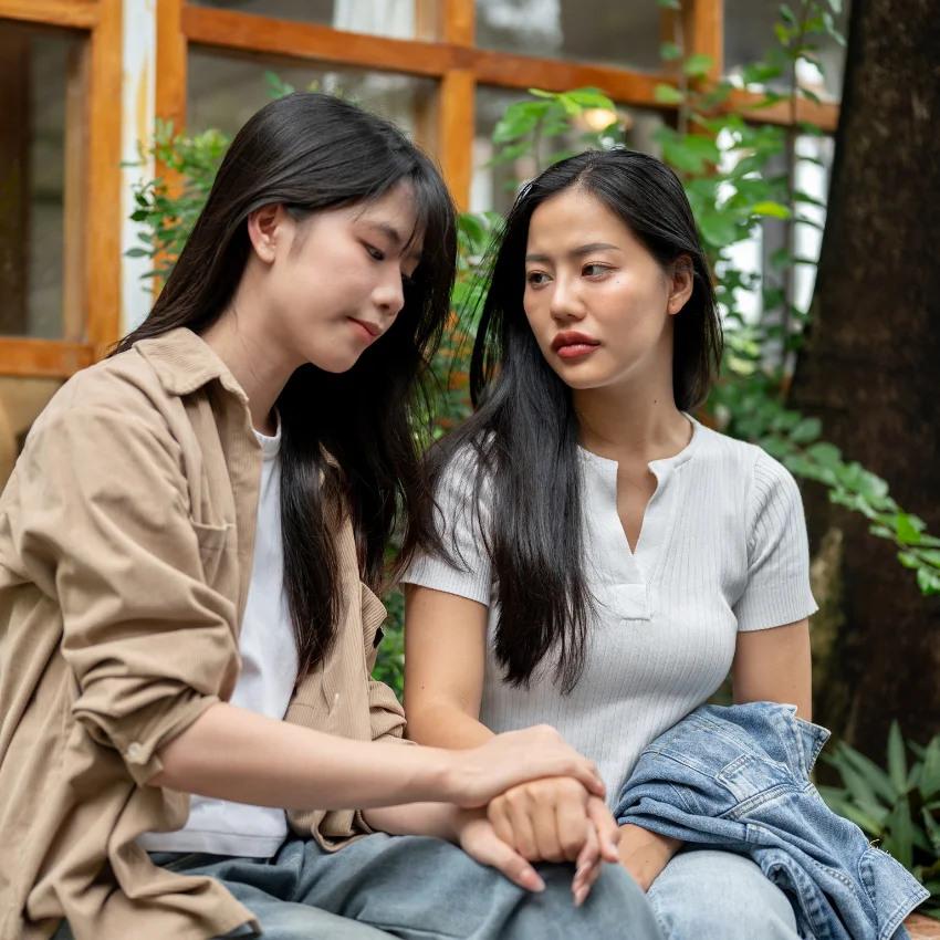 happy woman makes her life easier by forgiving her sister