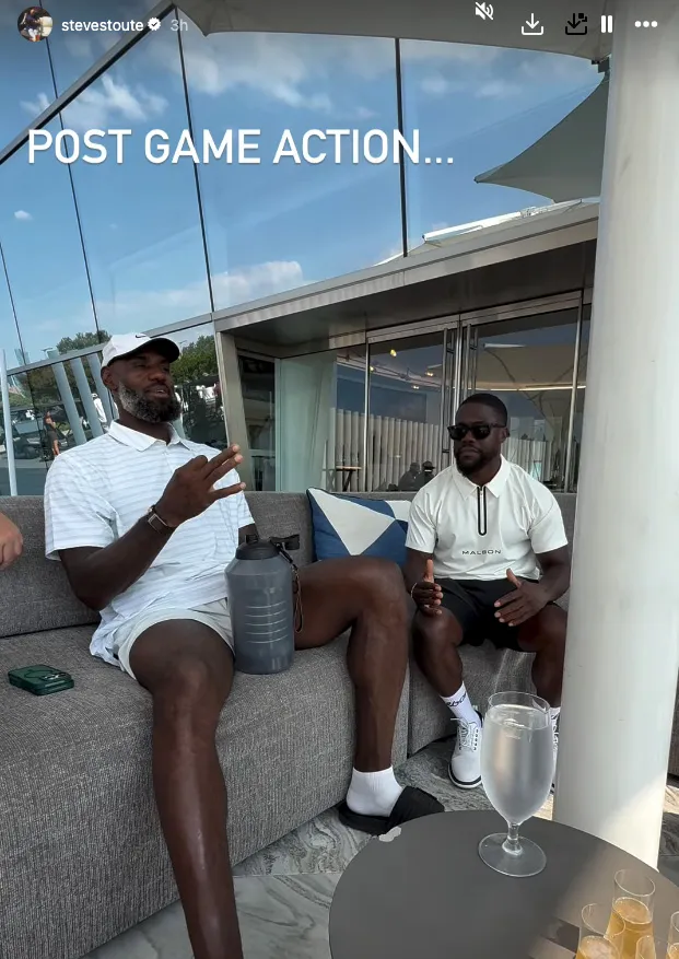 Steve Stoute and Kevin Hart sitting on a couch.