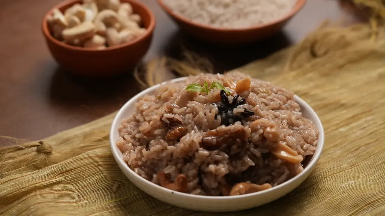 Traditional Kanika, a fragrant Odia sweet rice dish made with jaggery, whole spices, cashews and raisins, served during Jagannath Rath Yatra.