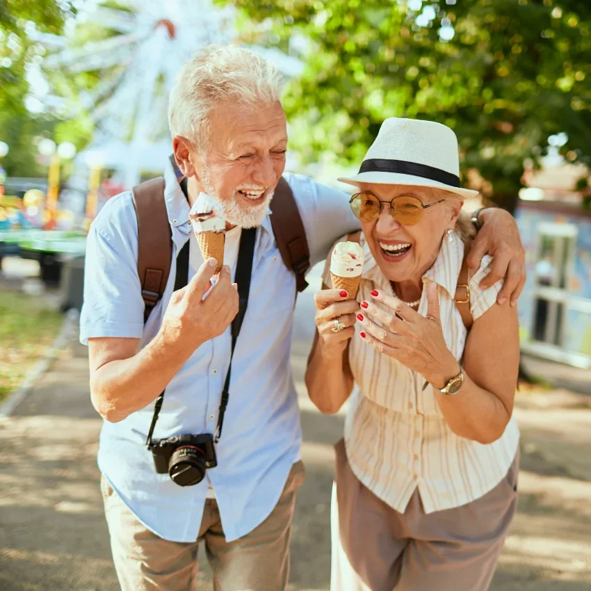 aging couple laughing to stay mentally physically strong
