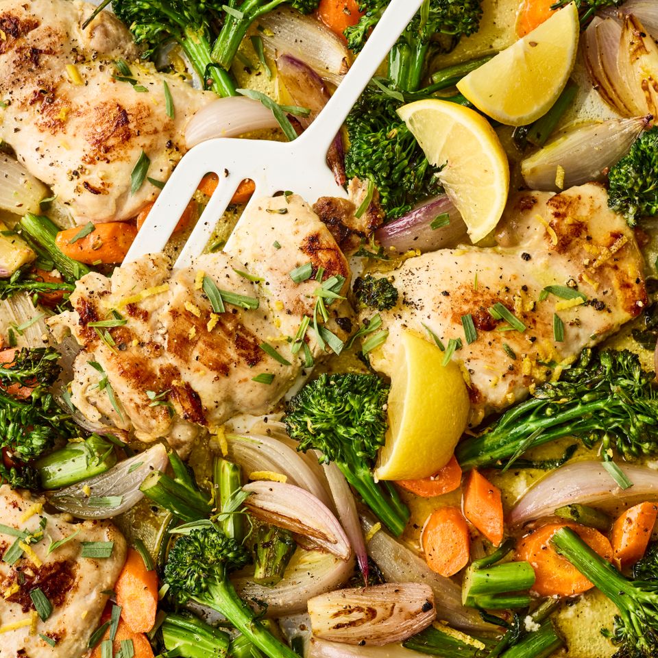 an image of the Sheet-Pan Lemon-Garlic Chicken with Vegetables Credit: Photographer: Victor Protasio, Food Stylist: Chelsea Zimmer, Prop Stylist: Christina Daley