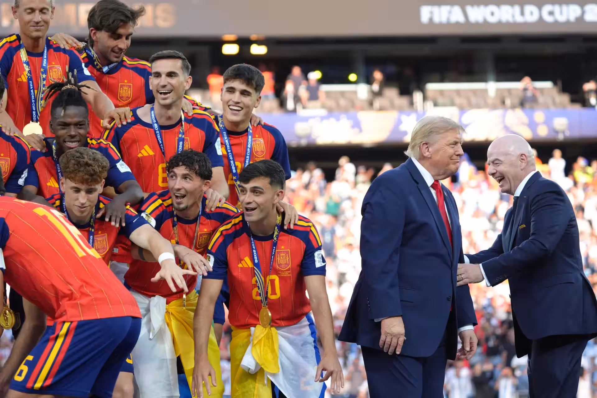 Spain players, from left, cheer alongside President Donald Trump and FIFA President Gianni Infantino at the conclusion of the World Cup championship final soccer match between Spain and Argentina in East Rutherford, N.J., Sunday, July 19, 2026. (AP Photo/Jacquelyn Martin) Trump WCup Soccer