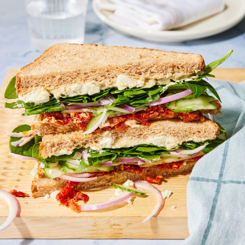 a recipe photo of the Spinach, Sun-Dried Tomato & Cucumber Sandwich Credit: Photographer: Stacy k. Allen, Props: Christina Brockman, Food Stylist: Lauren Odum