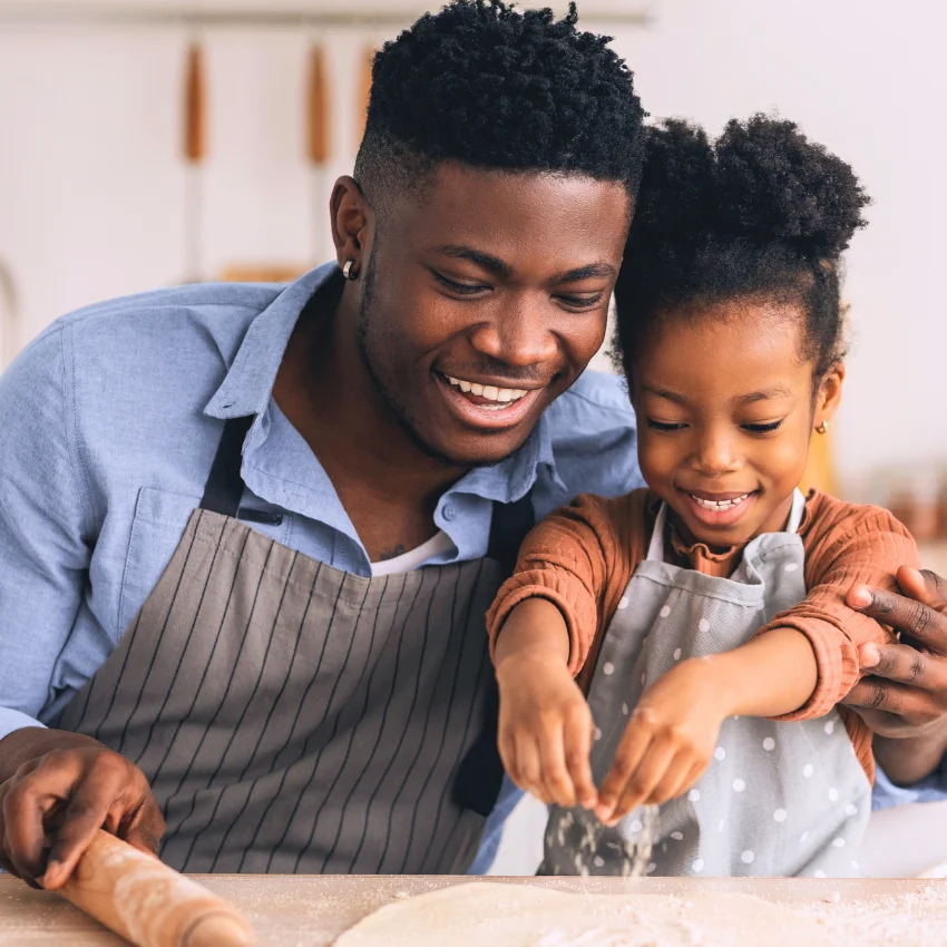 overwhelmed man baking with his daughter 