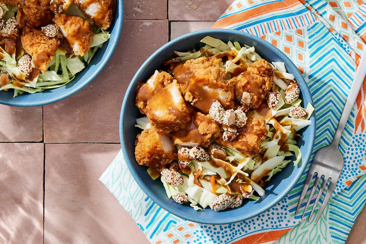 a recipe photo of the Chicken & Cabbage Bowls with Sesame Dressing Credit: Photographer: Rachel Marek, Prop stylist: Holly Dreesman, Food stylist: Gabriel Greco