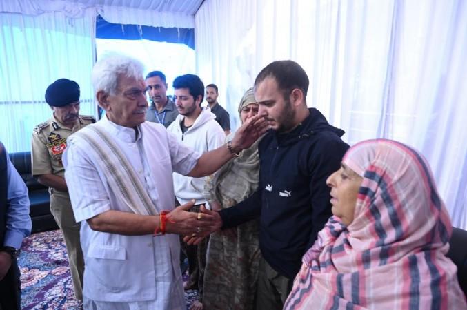 Jammu and Kashmir Lieutenant Governor Manoj Sinha with family members of martyred head constable of J&K Police Ashiq Hussain Qureshi. Manoj Sinha