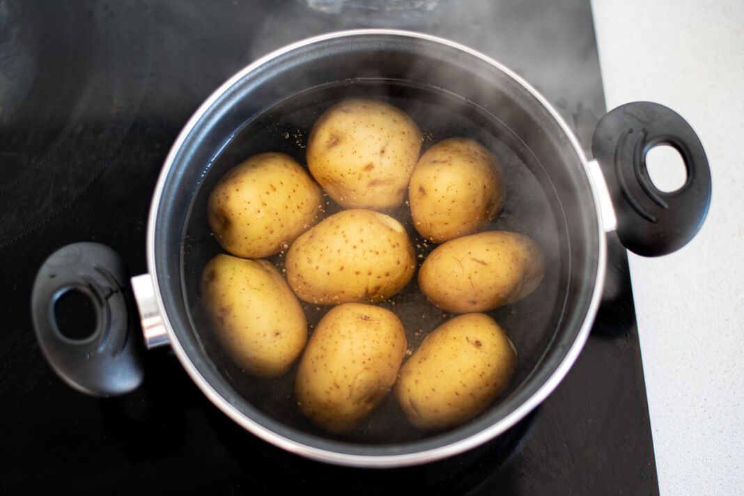 Potatoes in a pot with boiling water Potatoes in a pot with boiling water
