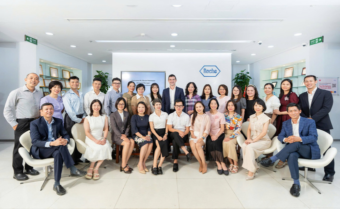 Burak Pekmezci with Roche Pharma Vietnam’s team in Hanoi. Photo courtesy of Roche Pharma Vietnam