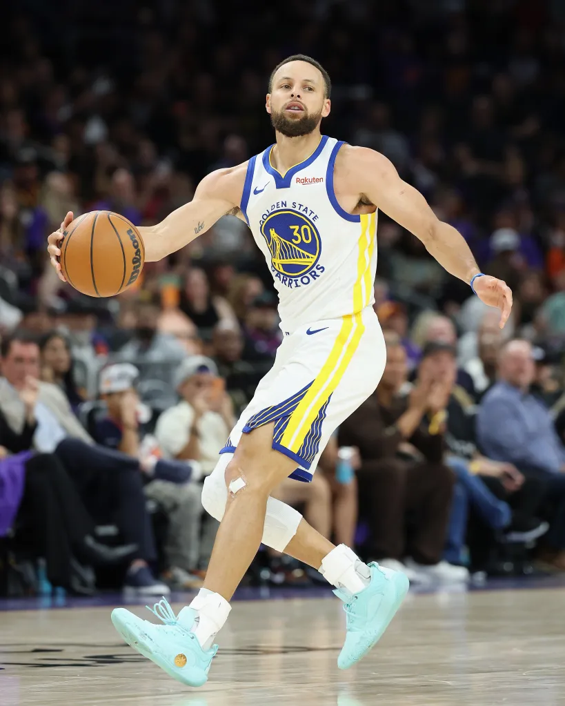 Stephen Curry dribbling a basketball during a game.